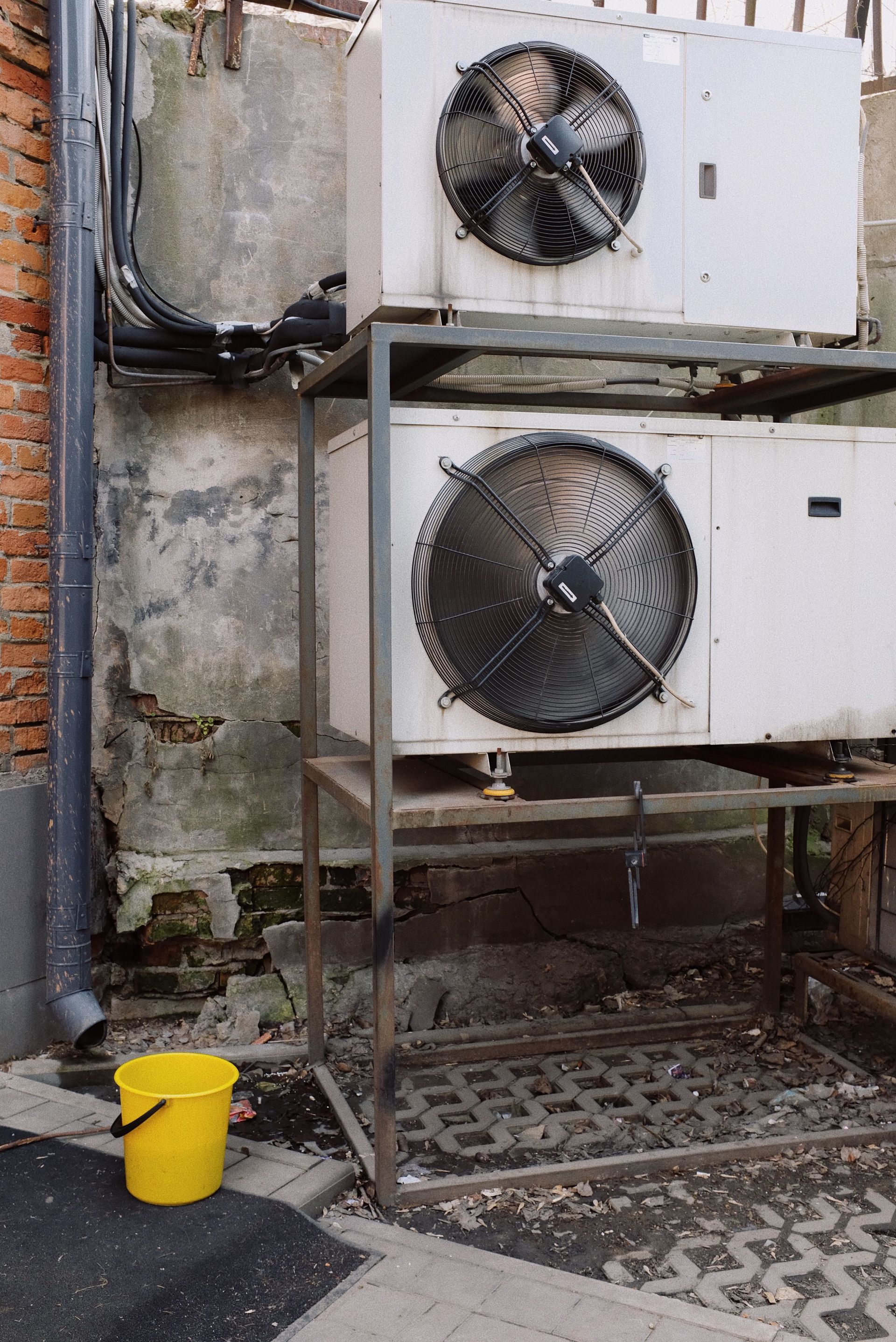 External units of air condition system installed on metal frame outside of building